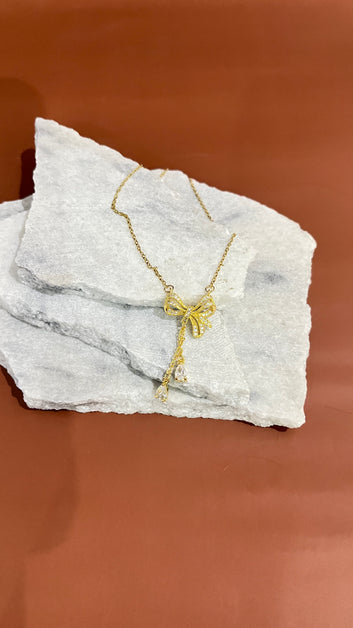Pearly gold bow